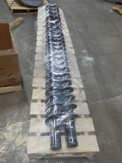 Long-Augers-Wrapped-lores Long, metal augers on pallet wrapped on TAB Wrapper Tornado at Falcon Industries
