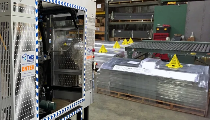 Construction materials and pallets wrapped by a TAB Wrapper tornado